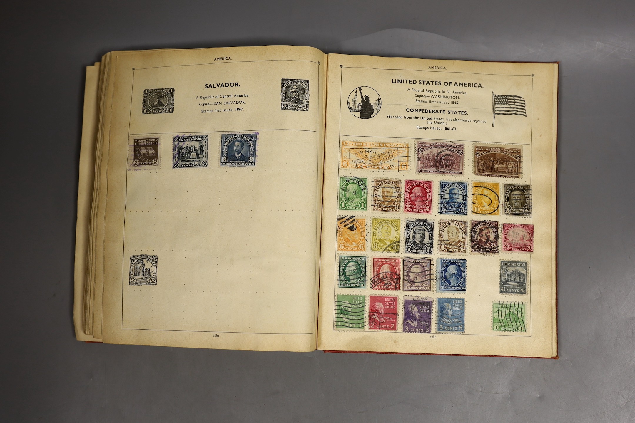 A stamp album of world stamps and a collection of loose stamps.